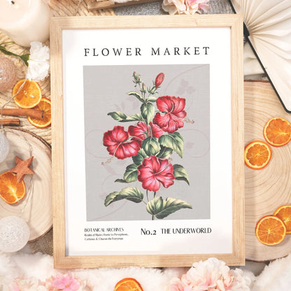 The Underworld Flower Market botanical art print, showcasing vivid red hibiscus flowers with dark, Greek-inspired aesthetics reminding us of Hades & Persephone, for bookish romantasy fans